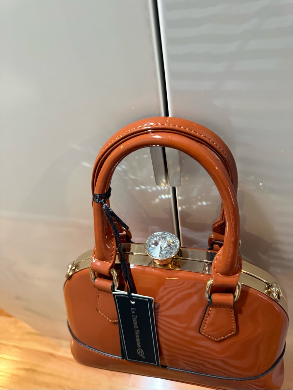 La Femme Orange Patent Mini Dome Handbag with Crystal Clasp